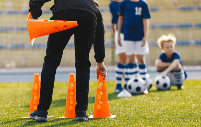 soccer coach putting down cone