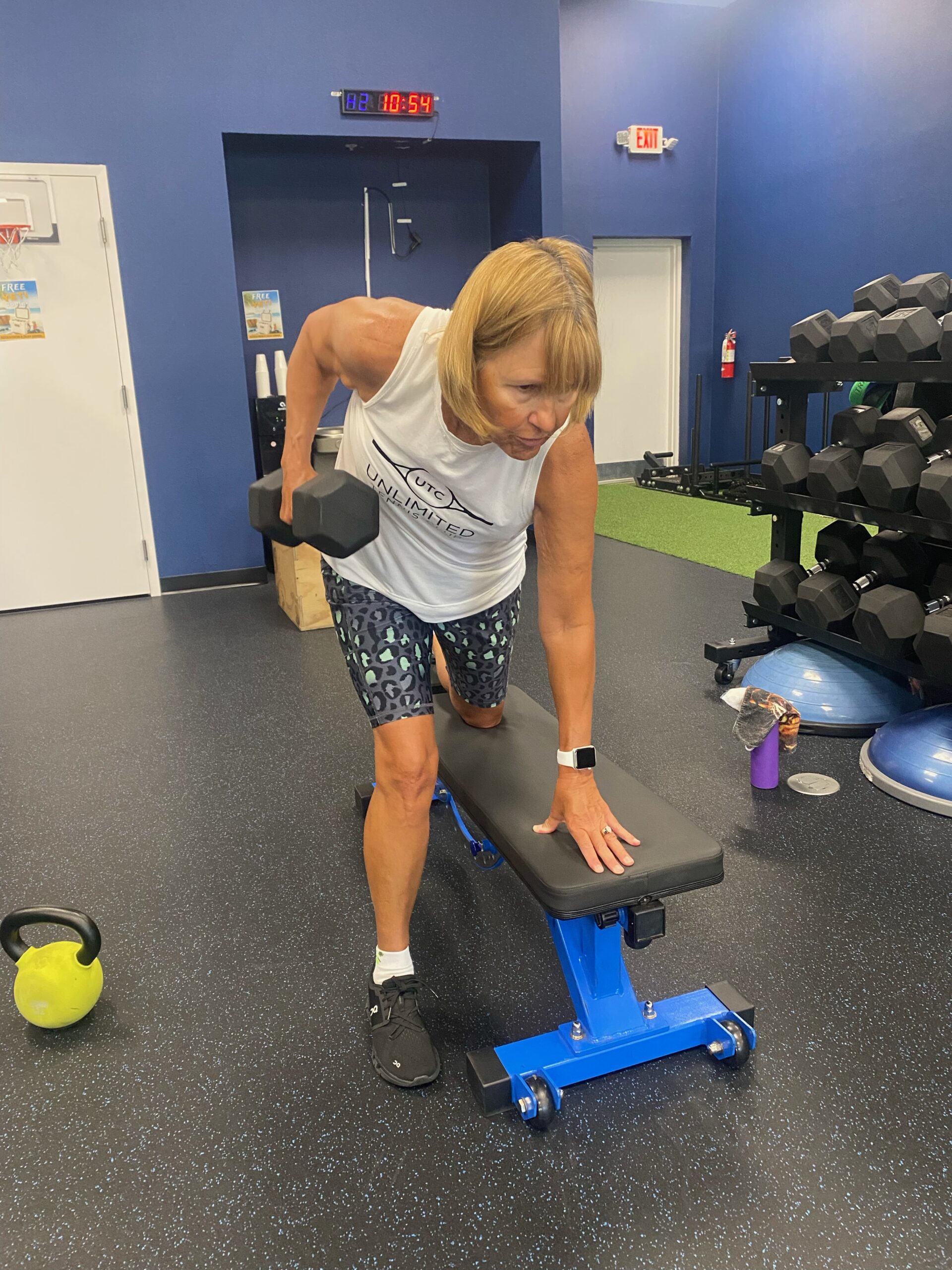 Back In Motion client strength training with a dumbbell